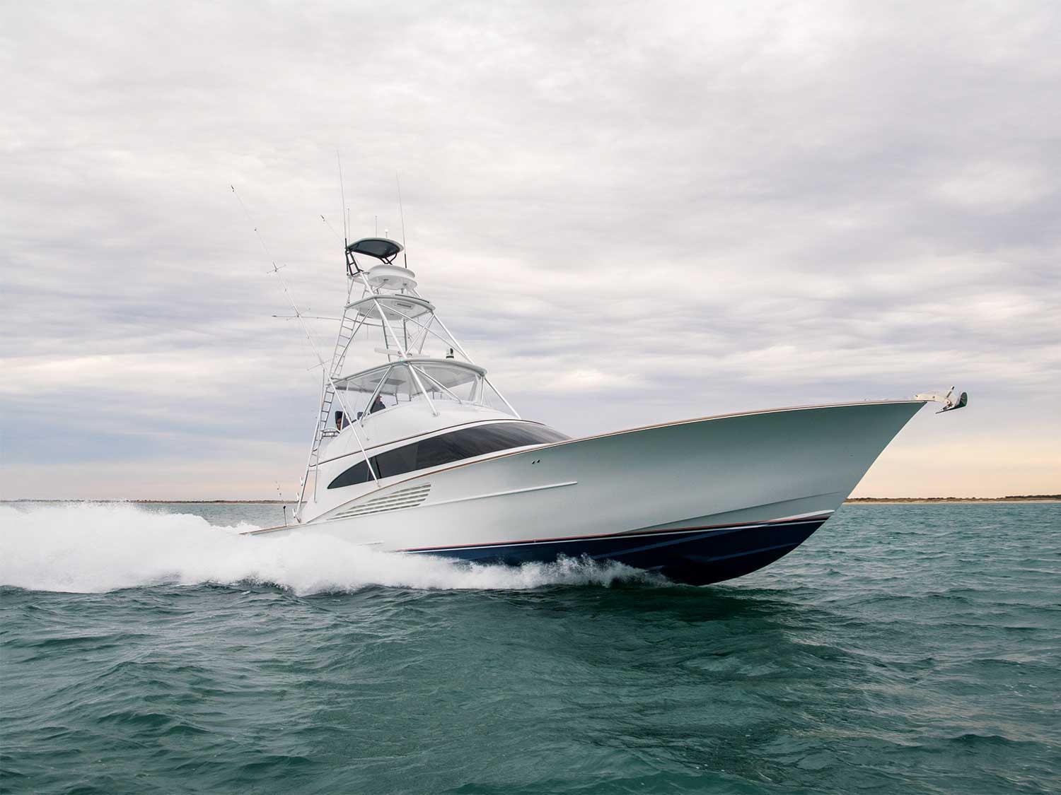 Winter Custom Yacht sportfisher after a gloss hull wrap, running offshore